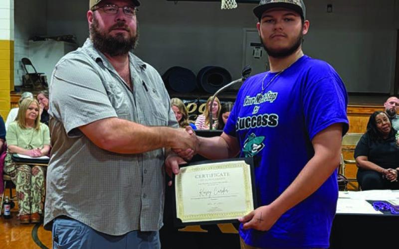 Jason Boyd presents the Cleveland County Cattleman’s Association Scholarship to Kasey Carder
