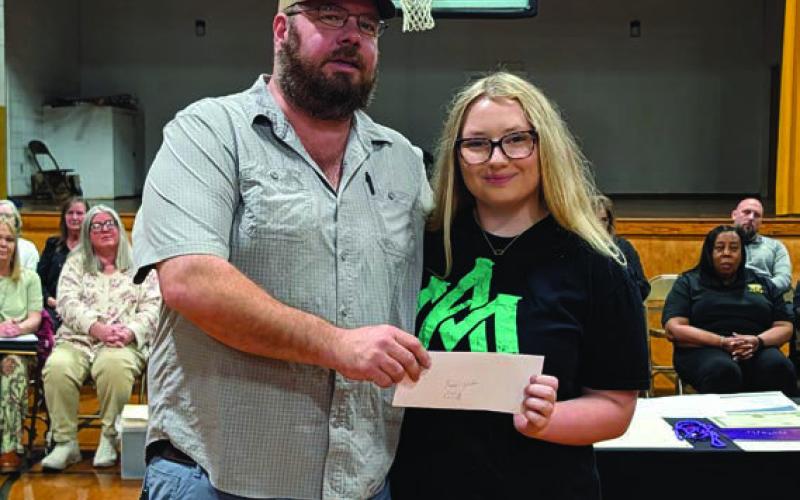 Jason Boyd presents the Cleveland County Conservation District Scholarship to Taylor Watson