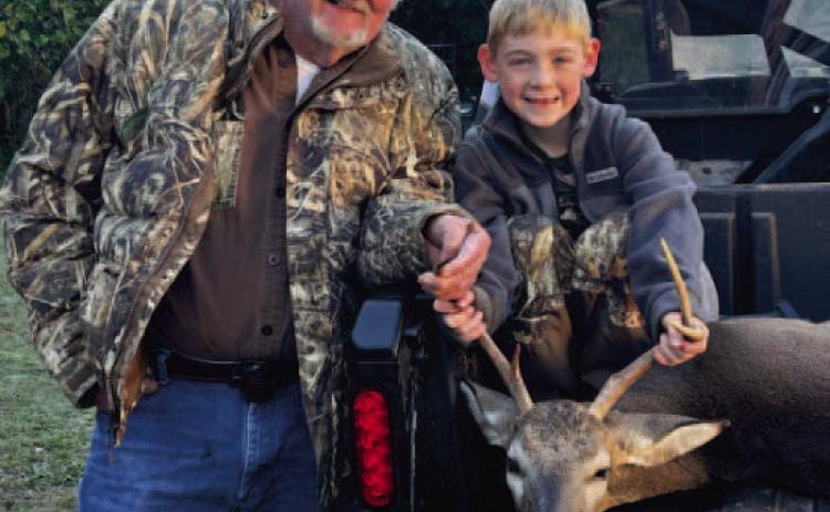 FIVE POINT - Locklan Smith, age 7, killed this five-point buck hunting with his Papa Jimmie Lockhart in Toledo .