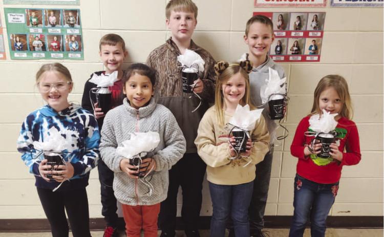 WOODLAWN ELEMENTARY FEBRUARY STUDENTS OF THE MONTH - These students consistently exhibited good behavior and were nominated by their homeroom teacher. Back Row: Ryler Shell (4th grade), Bentley Parker (6th grade), Jack Reed (5th grade); Front Row: Landree S ullivan (3rd grade), Anayeli Duran (2nd grade), Bellamy Reed (1st grade), Annika Knight (Kindergarten).