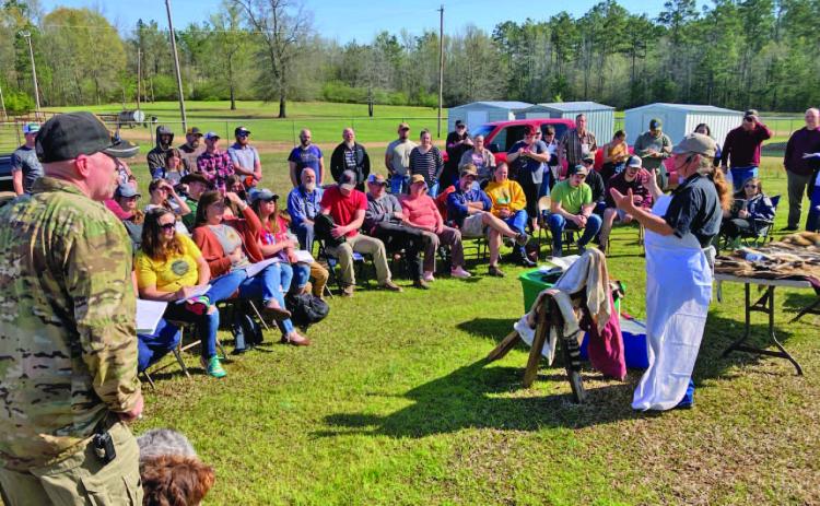 TANNING HIDES - Shona Jordan, a taxidermist and hometeader from Pike County, demonstrates the process of converting a hide into a pelt at the 2023 Arkansas Homesteading Conference. Jordan is scheduled be back as this year for one-on-one conversations.