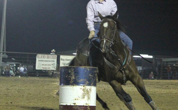 CLEVELAND COUNTY FAIR RODEO ACTION - Leanna Britton, an agri instructor at Rison High School, makes a turn during barrel racing action Saturday night at the Cleveland County Fair Rodeo. Fair Board President Roy Phillips said attendance was good for both Friday and Saturday night events, and the fair board wants to make the rodeo a central part of the fair in the future.