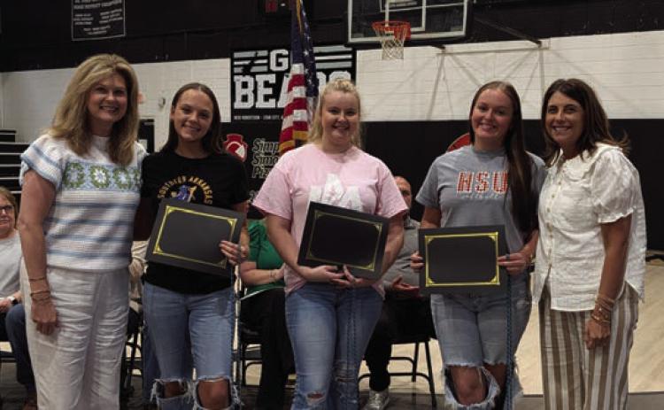 Jenny Saterlee (far left) and Stephanie Hollis (far right) present the AmeriCorps Scholarship to Jailyn Wright, Jaimie Simmons, and Karsyn Chastain