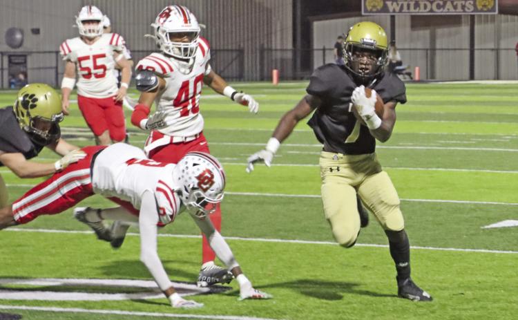 KINES TURNS THE CORNER - Rison running back DJ Kines (right, no. 7) finds the edge on the Drew Central defense to race 38 yards for the Wildcats’ first touchdown of the game. Kines finished with 165 yards rushing on 13 carries while fellow senior running back Bradyn Dupuy had 88 yards on 17 attempts, putting both over the 1,000yard rushing mark in final game of the regular season. (Photo by Chris Phillips)