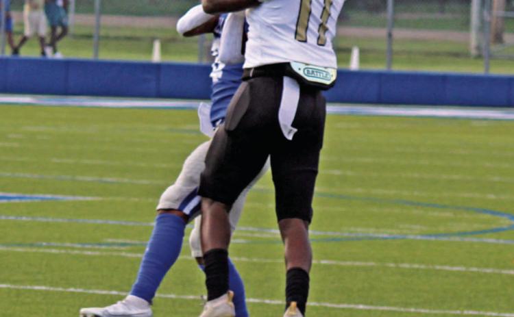 BIG SCRIMMAGE FOR WALKER - Rison junior Za'Kyler Walker wrestles the ball away from a Monticello defender before turning upfield for a 69yard gain on the Wildcat's first pass reception of the scrimmage. Walker had four catches for 124 yards.