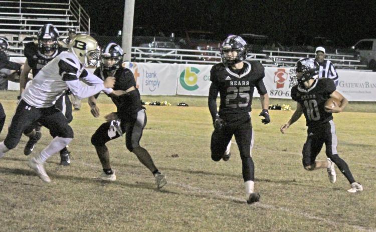 TRIPLE THREAT - Woodlawn senior running backs Caleb Martin (left) and Fisher Hale (center) set up a play for senior quarterback Jaxson Martin (right) during last Friday night’s 60-16 win over Brinkley. All three finished the game with more than 100 yards of total offense, helping the Bears amass 500 yards in total offense for the game.