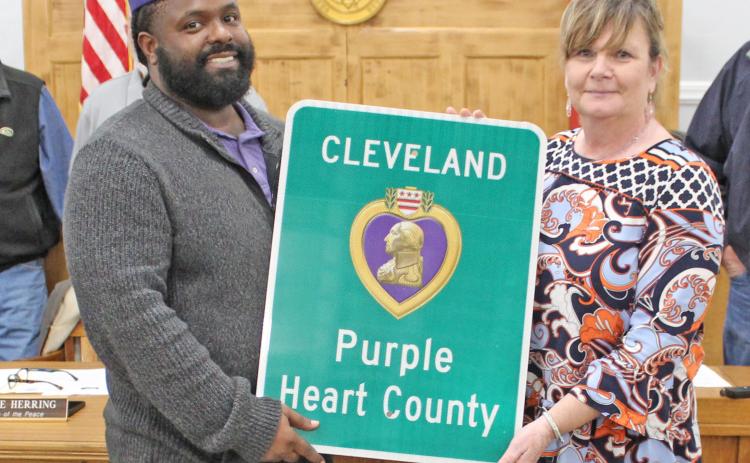 LOCAL VETERANS RECOGNIZED - Quinton Ezeagwula (left), commander of the Military Order of the Purple Heart Chapter 431 at Little Rock, looks on as those veterans attending Monday night’s Purple Heart declaration ceremony were recognized.