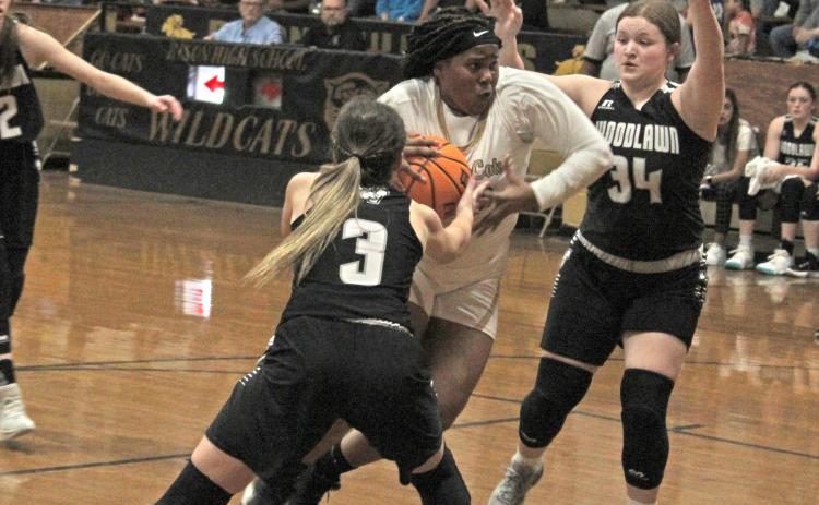 DRIVING THE LANE - Rison’s Shermyah Bracey drives the lane against Woodlawn’s Anna Fitzgibbon (nol. 3) and Skylar Conner (no. 34) in first half action of Tuesday’s battle of Cleveland County rivals.