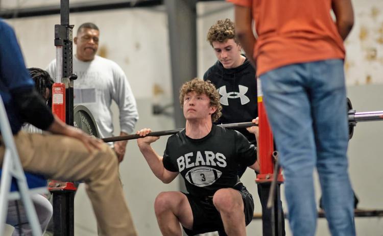 RAULS TAKES TOP LIFTER AT MONTICELLO - Woodlawn's Jude Rauls prepares for a lift at the Arkansas High School Power Lifting Association meet held this past Saturday at Monticello High School. Rauls tied a state record in the 148-pound classification with a lift of 245 lbs. In the bench press. His Schwartz formula rating was also the best of any lifter at the meet. (Photo courtesy of Meredith Wilkins, Woodlawn High School)