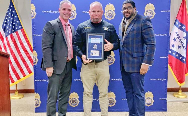 Jefferson County Sheriff's Sergeant Jimmy F. "Bo" Hudson, Jr. (center), was presented his DEA credentials during a brief ceremony at the Drug Enforcement Administration Little Rock District Office (DEA-LRDO). Making the presentation was Jared Harper (left), Assistant Special Agent in Charge of the DEA in Arkansas, and Sheriff Lafayette Woods, Jr. (right).