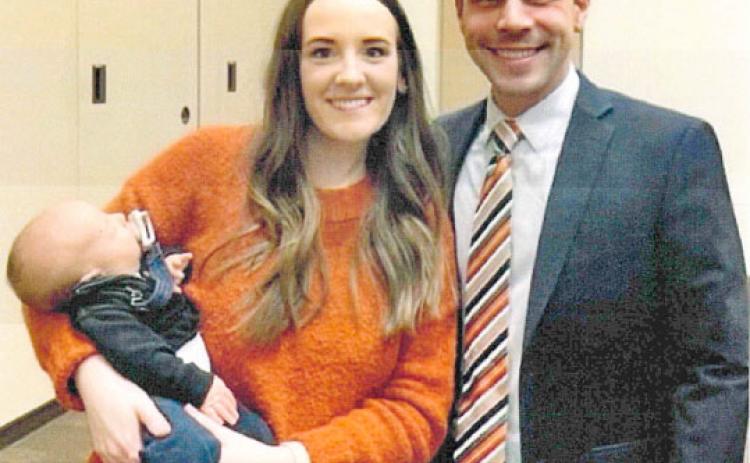 Rison Coach Caleb Carmikle (right) with wife, Madison Carmikle, and their new son, Cooper