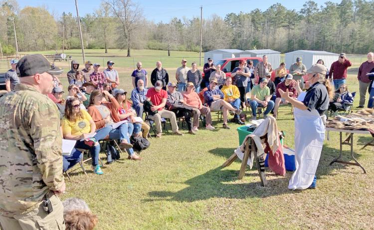 TANNING HIDES - Shona Jordan of Pike County prepares to demonstrate how to prepare a coon hide for tanning during one of the sessions at the Arkansas Homesteading Conference held Saturday at the Cleveland County Fairgrounds in Rison. More than 300 people from across the state took in the conference that offered educational sessions on wide variety of topics related to homesteading like gardening, herbal remedies, hydroponics, canning and more.