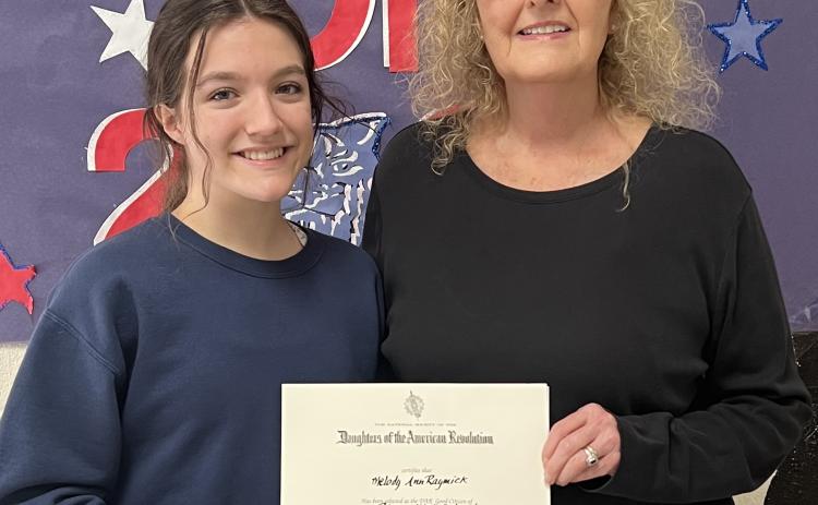 DAR AWARDS RISON SENIOR - Mrs. Barbara Drye of the Chicot Trace DAR Association (right) presents the 2023 DAR Scholarship to Rison High School Senior Melody Ann Raymick (left). This honor requires the recipient to exhibit qualities of good character to include but are not limited to: Dependability, Service, Leadership and Patriotism.