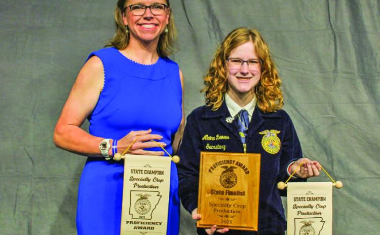 REEVES DECLARED STATE CHAMPION - Rison High School Future Farmers of America (FFA) adviser Leanna Britton (left) poses with Rison student Alaina Reeves (right) who was named state champion in Specialty Crop Production and received a Proficiency Award/State Finalist award during the Arkansas FFA Convention held last week at Hot Springs. Reeves received her Proficiency Award for her Supervised Agricultural Experience in developing her mushroom and micro-green business into Gnome Home Farms.