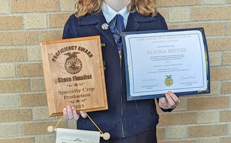 ALAINA REEVES - Alaina Reeves, a senior at Rison High School, poses with some of the awards she won during the Arkansas FFA Convention held this past spring.