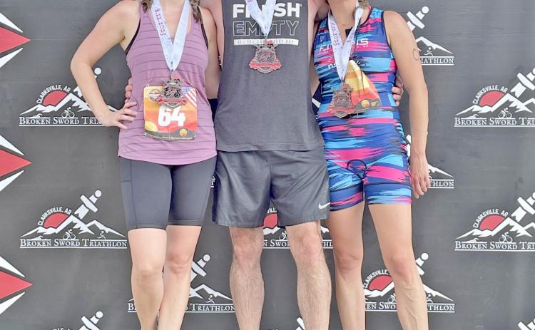 Julia Meyer of Kingsland, Les Walz of the Macedonia community and Lauren Leopard of Rison