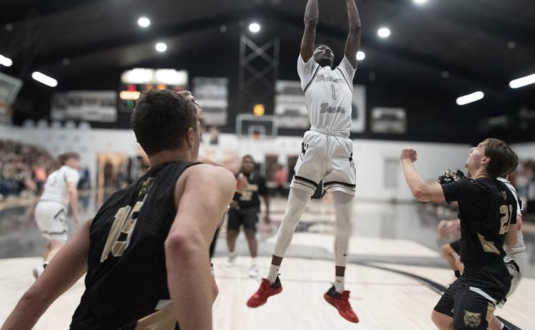 TO THE HOOP - Woodlawn’s Raylon Lawson (no. 1) goes to the basket during the Bears’ win over the county rival Rison Wildcats last Thursday in side the Woodlawn gym. Lawson led the Bears with 17 points. (Photo by Kelvin Scott/Cardboard Sports)