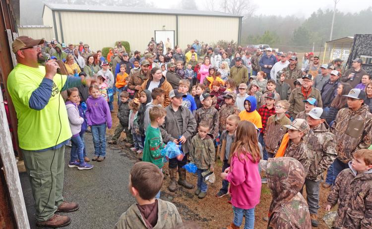 John Varnell, one of the organizers of the Cleveland County JAKES Day held at the Cleveland County Fairgrounds Saturday morning, gives instruction to the hundreds of youth and parents who showed up for the event aimed at encouraging kids to get involved in the outdoors.