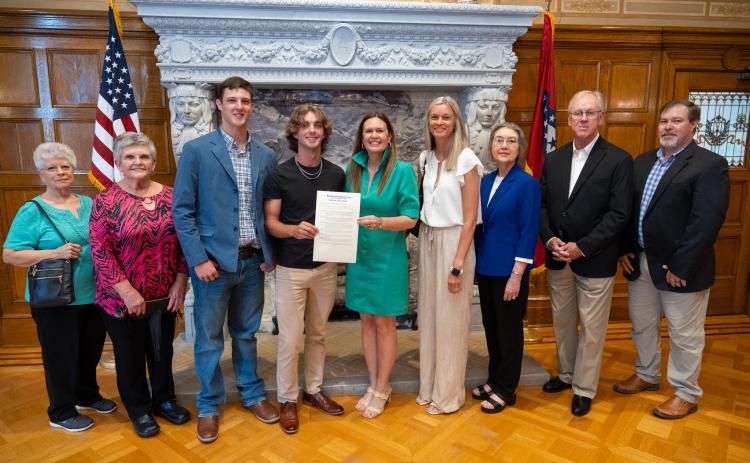 Pictured are (left to right) Kingsland Mayor Sharon Crosby, Kingsland City Council member Karen Wiscaver, Morrison, Kidd, Gov. Sanders, Saunders, Rita and Wayne Cash with the Cleveland County Historical Society and Cleveland County School District Superintendent Davy King.