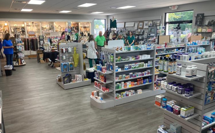 INSIDE NEW RISON PHARMACY - Visitors begin filing inside the new Rison Pharmacy and Wellness building for its open house last Friday morning. While the business moved into its new facility earlier this summer, Rison Pharmacy owner Lynn Wilson waited until last week to have an open house to officially kick off the new location. Wilson said the new building provides about twice as much space as the old location, and it also includes a new gym and fitness center called Rison Grind at the back of the building.