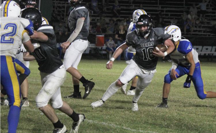OLIVER TAKES IT TO THE HOUSE - Woodlawn senior fullback Ethan Oliver (no. 16, right) looks to the outside behind the block of junior tight end Matthew Green (left, no. 40) before going 28 yards for the touchdown for his only carry of the game. The Bears rushed the ball just seven times with four of those scoring for scores before Guy-Perkins decided to end the game before the halfway mark of the second quarter. Also pictured for Woodlawn is lineman Landan Johnson (center of photo).