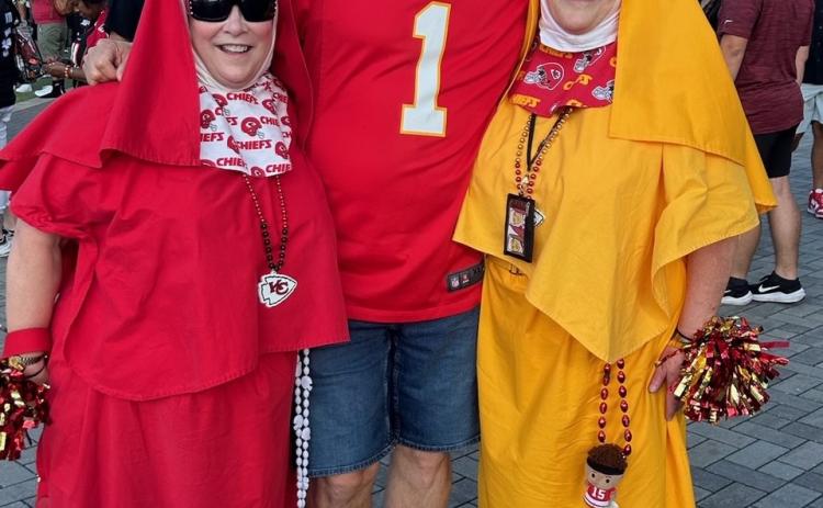 SUPER FANS - Roger Cooper (center) with a couple of fellow Kansas City Chiefs super fans he ran into a Atlanta. Cooper said he has seen the “nuns” at Kansas City as well, and the two ladies have become fan celebrities.