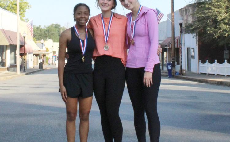 In the women’s division of the Race to Rison in the Fall 5K  the top three finishers were (left to right) first place, Kayka Jackson, 25:46; Riley Hyatt, 26:14; and Haven Simpson, 30:04.