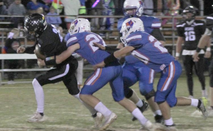 GRINDING IT OUT - Woodlawn’s Ethan Adair tries to elude the tackle fo Cedar Ridge’s Bentley Bullington during first half action of the Bears’ first-round playoff game at Cedar Ridge. The Bears outgained the Timberwolves on the ground, 219 yards to 75 yards, but Cedar Ridge was able to hit some big passes late in the game to pull out the win. Adair would later return a kickoff 57 yards for touchdown to tie the game, 44-44, with 1:51 left.