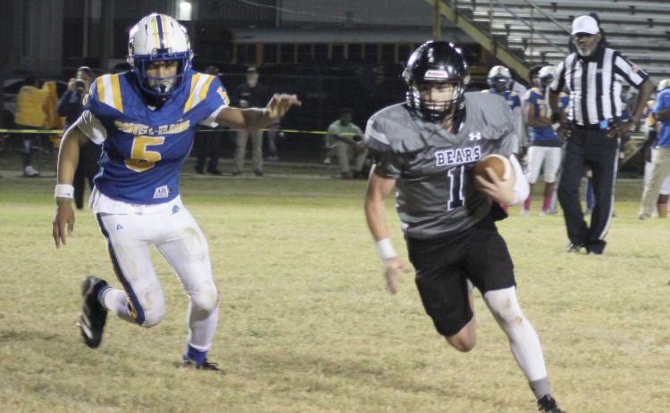 PRODUCTIVE GAME FOR MOORE - Woodlawn quarterback Aden Moore (right) breaks outside of Marvell’s Dimitrius Thompson for a two-point conversion in the Bears’ 64-26 win over Marvell last Friday night. Moore had a productive night on the ground and through the air running for two touchdowns and three two-point conversions while throwing for one TD and one two-point conversion. His teammate, Ethan Adair, also accounted for three touchdowns.