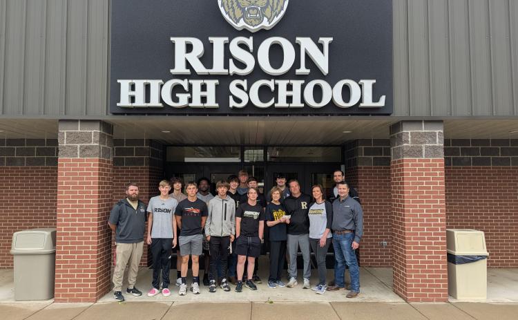 Pictured alongside a portion of the baseball team are coaches Chad Cope and Kyle Thaxton, Nora Terry, Kristy Lowery, Keden Shrum and Cordero Fuentes.