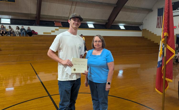 Pat Boyd presents the George Boyd Memorial Scholarship to Tucker McKnight