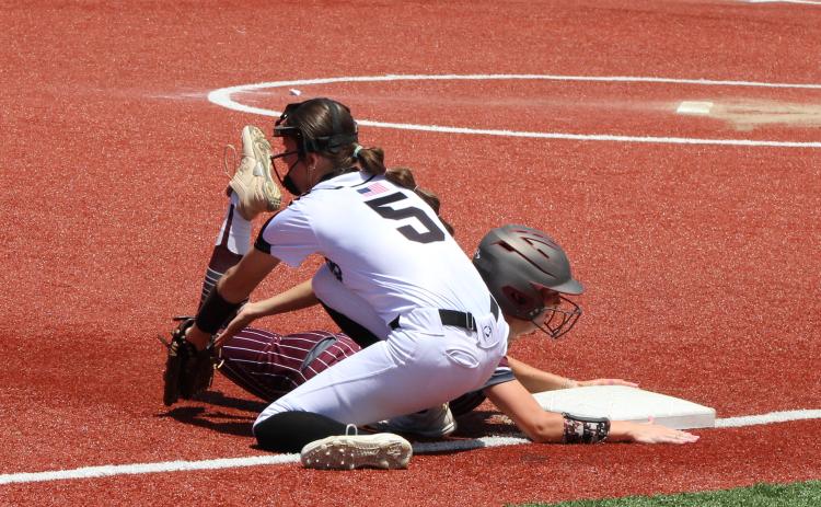 CRITICAL PLAY - Riverside’s Carly Jo Womack beats out the tag from Woodlawn’s Kathryn Dixon at third base in a critical play in the top of the fifth. Her slow-rolling liner into left gave her enough time to squeeze out a triple, eventually scoring the game’s only run on a passed ball with two out.