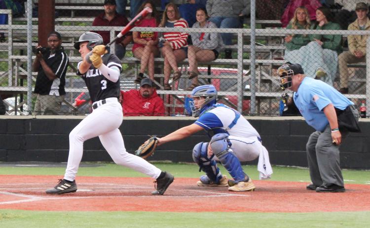WELLS HOMERS IN FINAL AT-BAT - Woodlawn senior Peyton Wells (left) launches a homerun in what would be his final at-bat on his home field Saturday against the Parkers Chapel Trojans. The dinger added two more runs to give the Bears a 24-3 lead in the bottom of the third. Wells went 2-for-3 at the plate and had five RBIs. Fellow senior Tate Hall had a homerun in the first inning.