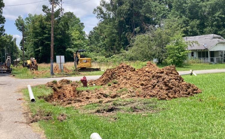 WATER LINE PROJECT BEGINS - A boring machine and excavator sit ready at the intersection of Washington and Center Street in the Lanwood section of Rison Tuesday to begin installing new water main pipe.