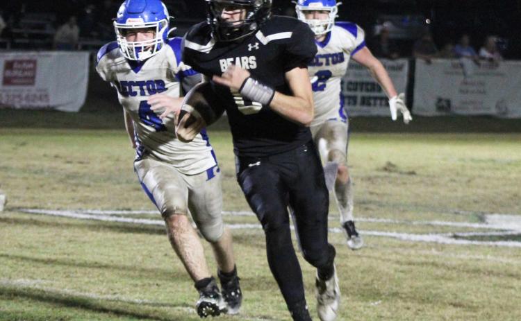ANOTHER BIG RUN - Woodlawn quartrerback Ethan Saeler turns up field for another big run while two Rector Cougars trail in pursuit during Friday night’s semifinal game. Saeler had a season-high 345 yards of rushing with five touchdowns. He had six runs for 20 yards or more.