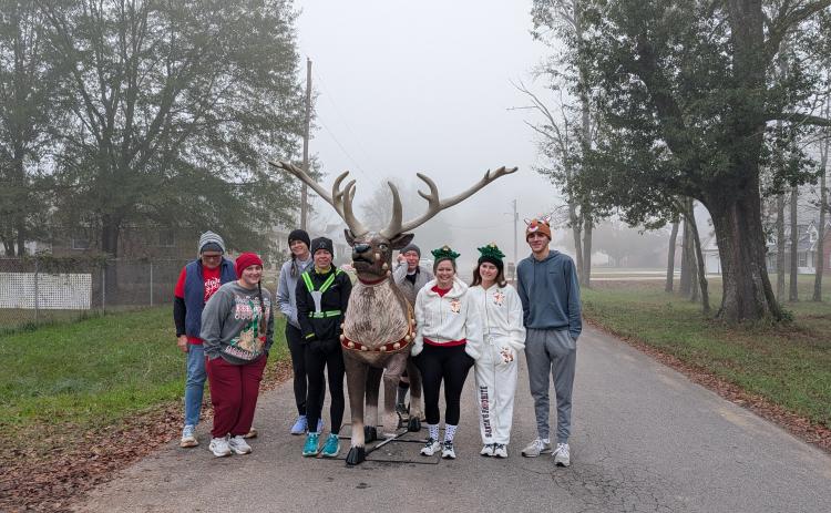 REINDEER RUN 5K - The Pioneer Village hosted the Reindeer Run 5K Saturday, Dec. 6. Pictured are Village President Marty Bowlin with runners Alyssa Parker, Kristie Saunders, Lauren Threlkeld, David West, Alicia Woody, Alivia Nixon, Jack Menard.