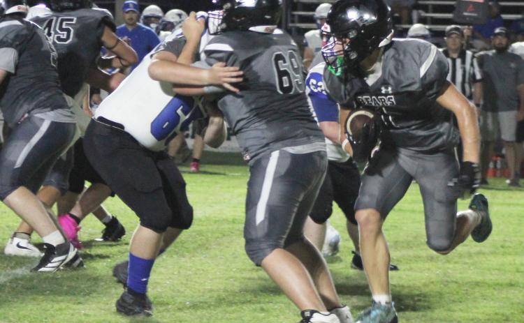 BIG OPENER FOR MANES - Woodlawn junior running back Griffin Manes (right) follows the block of Ashton Edwards (left) for more positive yardage against the South Side-Bee Branch Hornets. Manes, who was an All-State selection as a sophomore, put up 247 yards rushing on 15 carries with two touchdowns. He also caught a 43-yard touchdown pass.
