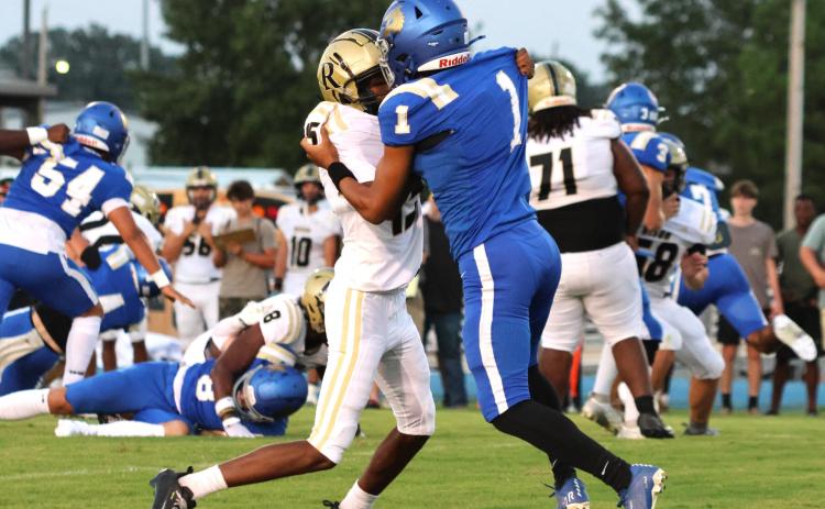 PETERS MAKES KEY INTERCEPTION - Rison sophomore Yukobion Peters (left), seen here working against a DeWitt receiver, came up with a huge play for the Wildcats in the second half when he intercepted a pass in the second half after Rison had extended its lead to 27-14. His pick set up another score that pushed the cushion to 35-14 and turned the momentum of the game. (Photo by LeeAnn Morgan)