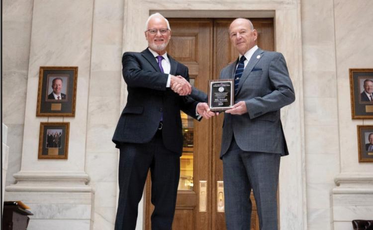 MUNICIPAL LEAGUE RECOGNIZES HOLCOMB - The Arkansas Municipal League has presented District 93 State Rep. Mike Holcomb with the Distinguished Legislator Award in recognition of his work during the 2025 Regular Session. Holcomb's district includes a section of northern and eastern Cleveland County. Pictured are Jack Critcher (left), legislative liaison for the Arkansas Municipal League, and State Rep. Mike Holcomb (right).
