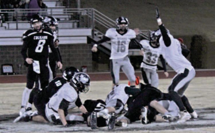 ONSIDE KICK RECOVERY - Woodlawn (white) and Izard County (black) players react after the Bears' Payton Leveritt (on the ground, right) came up with a onside kick recovery that enabled the Bears to erase a 16-point fourth quarter and tie the game, 56-56, with 2:24 left. Pictured for Woodlawn are (on ground, left to right) Landen Booth, Matthew Vontungeln and Leveritt; (standing, left to right) Ethan Oliver (no. 16), Aidan Moore (no. 33) and Jaxson Raney (no. 24).