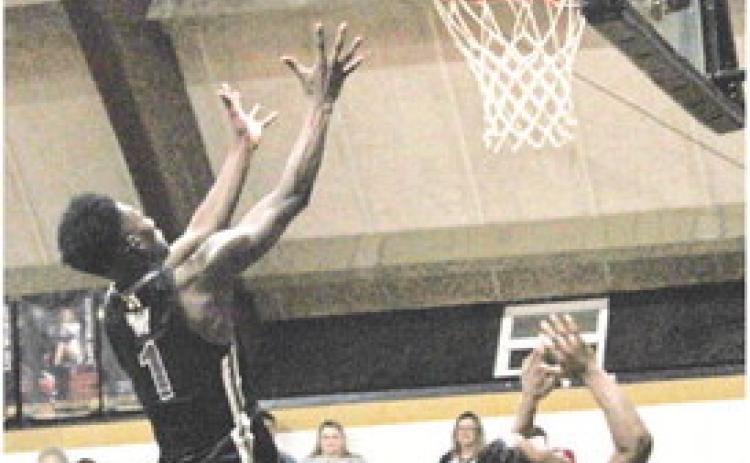 LAWSON MAKES ALL STATE TOURNAMENT TEAM - Woodlawn's Raylon Lawson (no. 1), seen in this file photo playing against Rison, earned All State Tournament Team honors after scoring 23 points in the Bears' 6052 loss the Lavaca Golden Arrows in the first round of the Class 2A State Tourmament last week at Mansfield High School. Woodlawn cut a 17-point halftime deficit down to four with 2 minutes left before Lavaca was able to turn back the rally.