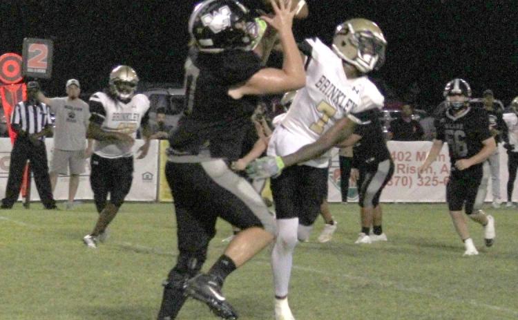 KITCHENS TAKES IT TO THE HOUSE - Woodlawn junior tight end Braiden Kitchens pulls in a pass over Brinkley’s Tylon Jones before turning upfield for a 17-yard touchdown reception in the second quarter. Kitchens’ score pulled the Bears even with the Tigers, 12-12.