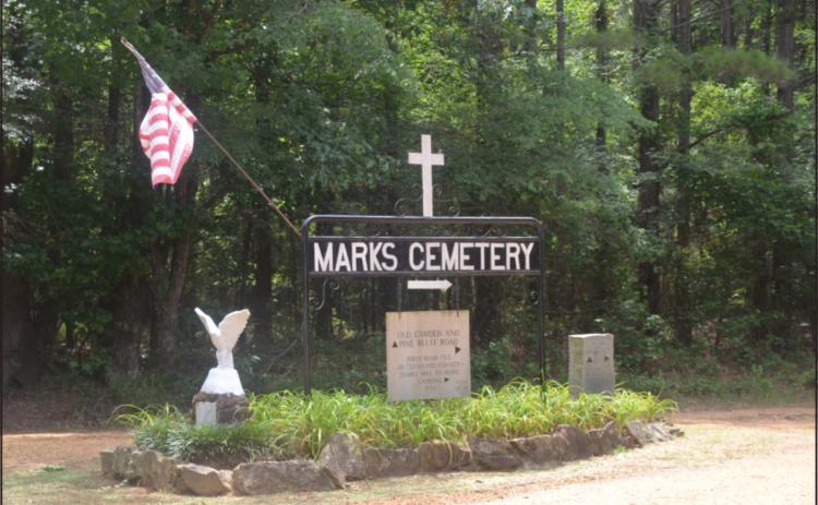 MARKS REUNION STILL GOING FOR 150 YEARS - The sign marking the entrance to the Marks Cemetery shows visitors how to get to one of Cleveland County’s oldest cemeteries tucked away among the pines off Hwy. 97 between Kingsland and New Edinburg. The cemetery has become the site for the Marks Family Reunion, which has been held annually since 1876. The cemetery is located near the location where the first shots of the Civil War Battle of Marks Mill were fired in April 1864. (Photo by Richard Ledbetter)