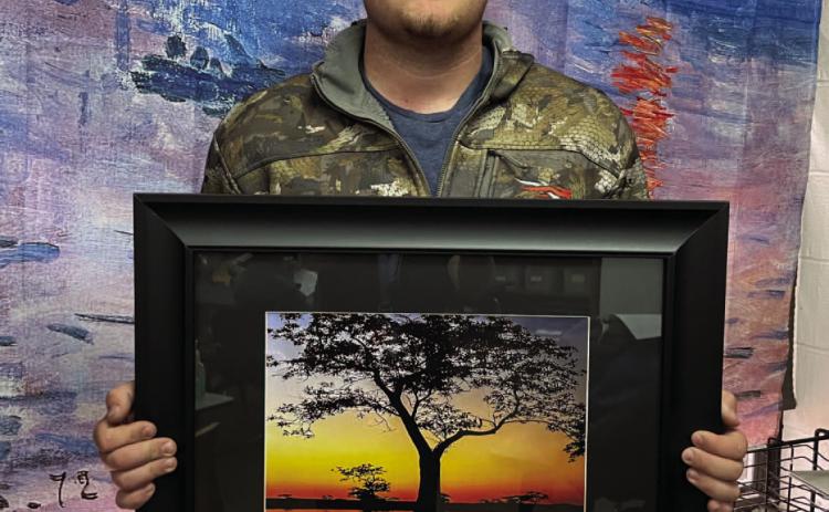 Braden Matthews and "Sunrise Before the Hunt" Photo credit: Lesley Hipp, Rison High School Art Teacher