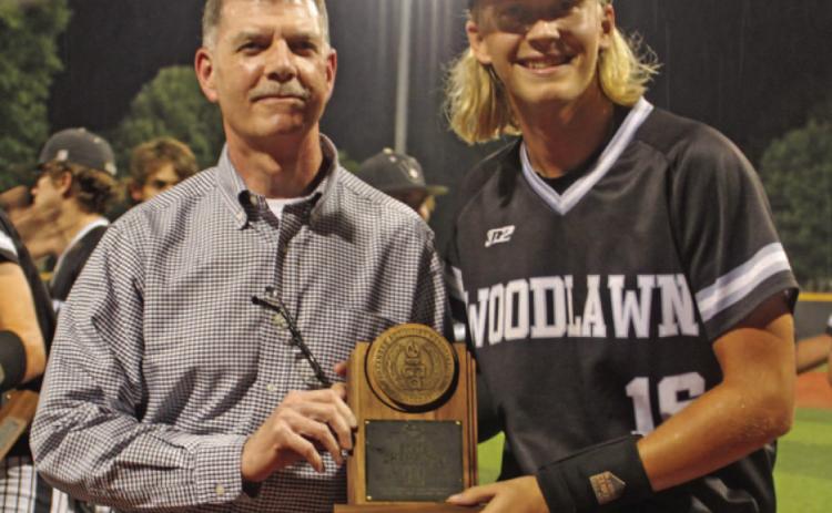 STOVER NAMED STATE CHAMPIONSHIP GAME MVP - Woodlawn relief pitcher Owen Stover (right) receives the Class 2A State Championship Game Most Valuable Player trophy from Cleveland County Farm Bureau agent Wilton Johnston after Friday night's game. Stover managed to preserve the Bears' lead after going in with bases loaded and one out in the top of the fifth inning. While he was called for a balk that did score a run for Palestine-Wheatley, Stover shutout the Patriots the rest of the way.