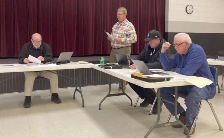 WOODLAWN SCHOOL BOARD MEETING - Woodlawn Superintendent Dr. Kevin Hancock (center) addresses the Woodlawn School Board during its regular monthly meeting Monday night. Hancock went over the impact the new Arkansas LEARNS Act will have on the school district. Also pictured are (left to right) Board President Larry Reynolds, Board Secretary Shane Dixon and board member David Stover.