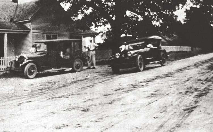 GLIMPSES FROM THE PAST - The people seen in this glimpse fro m the past are not identified, but this is the old Mosley home and a couple of cars in front of the residence on East Magnolia Street (Hwy. 133) in Rison in 1927. For questions or comments, contact Stan Sadler at sadler.stan@yahoo.com