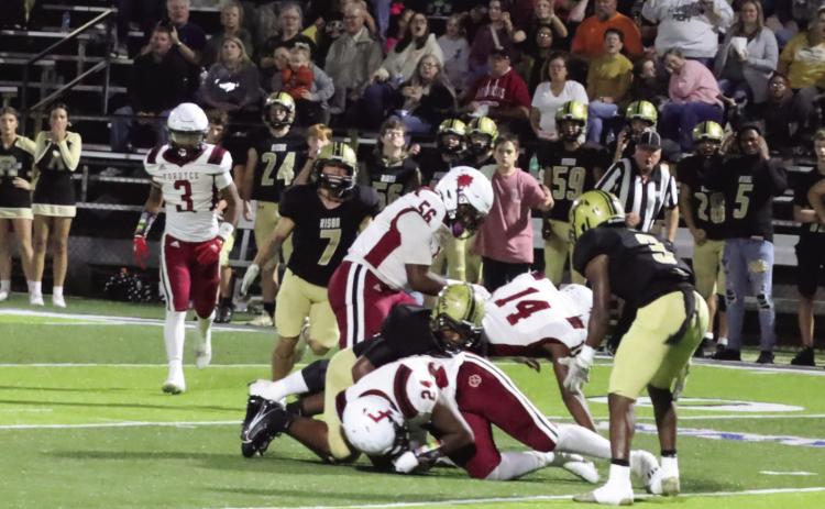 EARLY TROUBLE FOR WILDCATS - Fordyce's Carmillo Allen (center, no. 24) beats out Rison's Galvin Wilson (center, on top) to recover an early fumble by the Wildcats inside their own 30 yard line. The Redbugs cashed in on the mistake as Fordyce quickly cashed in for a 14-0 lead early in the game. Also pictured for Rison are Steven Shaddock (no. 7, left) and Za'Kyler Walker (no. 3, right). (Photo by Christine Phillips)