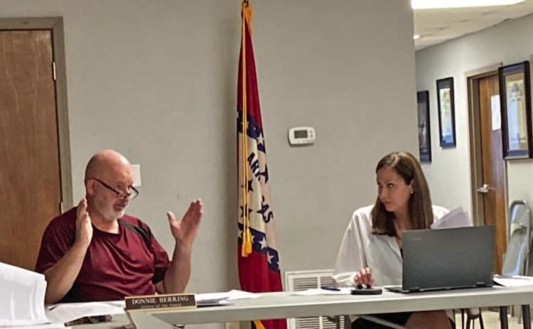 DATA MINING DISCUSSION - Justice of the Peace Donnie Herring (left) of talks to County Attorney Tiffany Nutt about some of the issues surrounding an ordinance that establishes building guidelines for data mining centers in Cleveland County. Herring, along with Justice Charles Rodgers of Rison, were both critical of the centers. Herring cited the fact that the centers are a tremendous drain on a community's electrical infrastructure and the centers do not provide any tax or employment benefits.