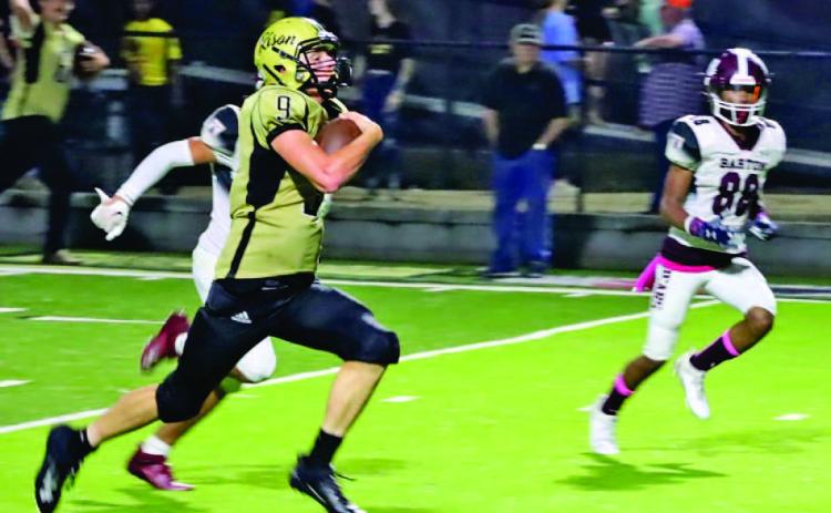 TOUCHDOWN BOUND - Rison senior quarterback Owen Morrison breaks into the open on his way to one of five touchdowns he scored in Friday night's upset win over Barton. Morrison finished with 103 yards rushing on 20 carries, kicked for PATs and had a 51-yard punt late that flipped the field position for the two teams. Morrison is one of six Wildcats since 1960 to have scored five touchdowns in a game. (Photo by Chris Phillips)